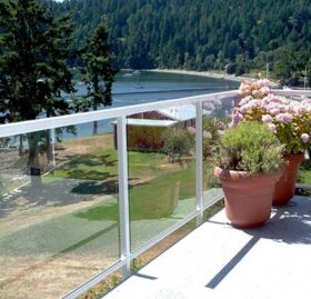 Duradek Supreme Chip Granite Vinyl Decking and Glass Railing with White Posts